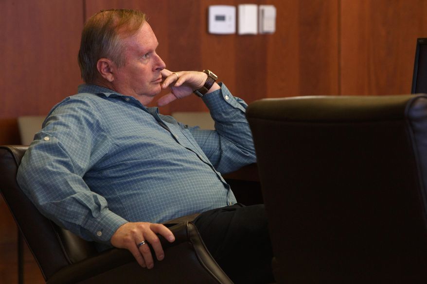 Lorin Holm listens as as his ex-wife, Linda Peine testifies in 5th District Court in St. George, Utah, Tuesday, March 25, 2014, during a hearing in which Holm is seeking custody of the couple's minor children due to Peine's status as a member of the Fundamentalist Church of Jesus Christ of Latter-Day Saints. Holm's was recently granted visitation with his children, more than a year after his family fractured when he was kicked out of the polygamous sect led by Warren Jeffs. (AP Photo/The Spectrum & Daily News, Jud Burkett, Pool)