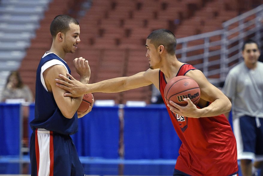 Arizona guard Nick Johnson, right, and guard Gabe York joke around during practice at the NCAA men's college basketball tournament, Wednesday, March 26, 2014, in Anaheim, Calif. Arizona faces San Diego State on Thursday in a regional semifinal. (AP Photo/Mark J. Terrill)