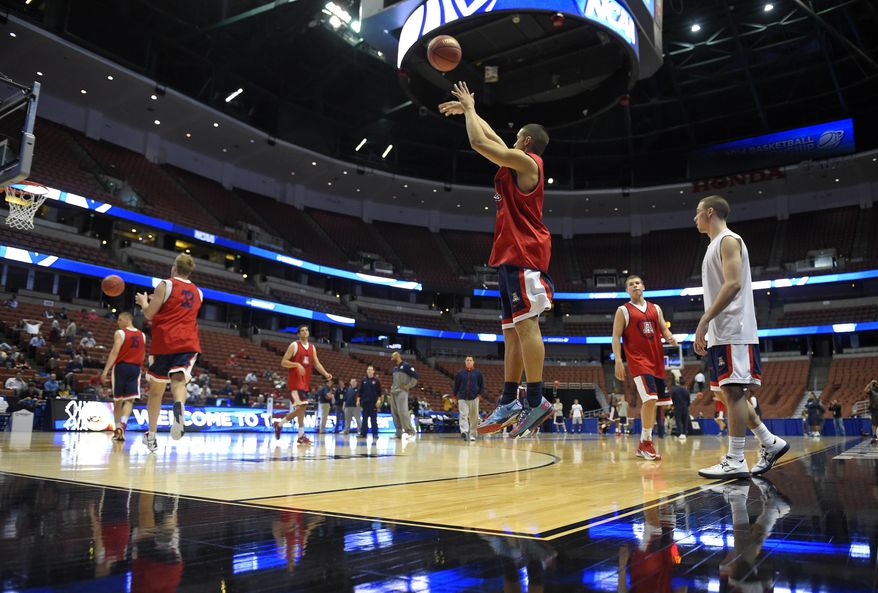 Arizona guard Nick Johnson shoots during practice at the NCAA men's college basketball tournament, Wednesday, March 26, 2014, in Anaheim, Calif. Arizona is scheduled to play San Diego State on Thursday in a regional semifinal. (AP Photo/Mark J. Terrill)