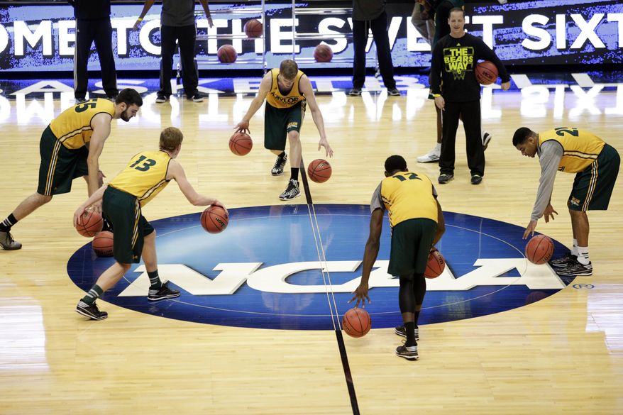 Baylor players dribble during practice at the NCAA college basketball tournament on Wednesday, March 26, 2014, in Anaheim, Calif. Baylor plays Wisconsin in a regional semifinal on Thursday. (AP Photo/Jae C. Hong)