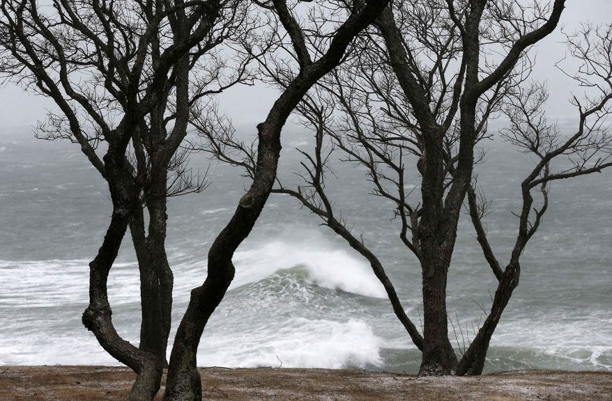 Wind-driven waves come ashore in Scituate, Mass., Wednesday, March 26, 2014. Cape Cod and the islands were expected to bear the brunt of the spring storm that struck full force Wednesday. The storm could drop up to 10 inches of snow with winds up to 70 miles per hour. (AP Photo/Michael Dwyer)