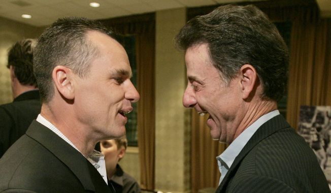 ** FILE ** Former co-captain of the Providence College Friars basketball team Billy Donovan, left, chats with a former coach of the team, Rick Pitino, in Providence, R.I., in this  May 11, 2007 file photo, at a 20th-anniversary celebrations of the 1986-87 team&#x27;s trip to the Final Four.  (AP Photo/Steven Senne)