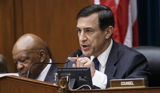 **FILE** House Oversight Committee Chairman Darrell Issa (right), California Republican, with the committee&#39;s ranking member, Rep. Elijah Cummings, Maryland Democrat, continues his probe of whether tea party groups were improperly targeted for increased scrutiny by the Internal Revenue Service as the panel questions IRS Commissioner John Koskinen on March 26, 2014, during a hearing on Capitol Hill in Washington. (Associated Press)