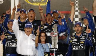 FILE - In this July 6, 2013, file photo, driver Jimmie Johnson, far right, celebrates with his crew and car owner Rick Hendrick, left, after winning the NASCAR Sprint Cup auto race at Daytona International Speedway in Daytona Beach, Fla. Hendrick watched victory slip away for two of his drivers at Auto Club Speedway. Johnson was leading in the closing laps until a tire failure sent him to pit road and cost him his first win of the season. His misfortune appeared to be Hendrick Motorsports teammate Jeff Gordon&#39;s gain, though, as Gordon inherited the lead from Johnson. (AP Photo/Reinhold Matay, File)