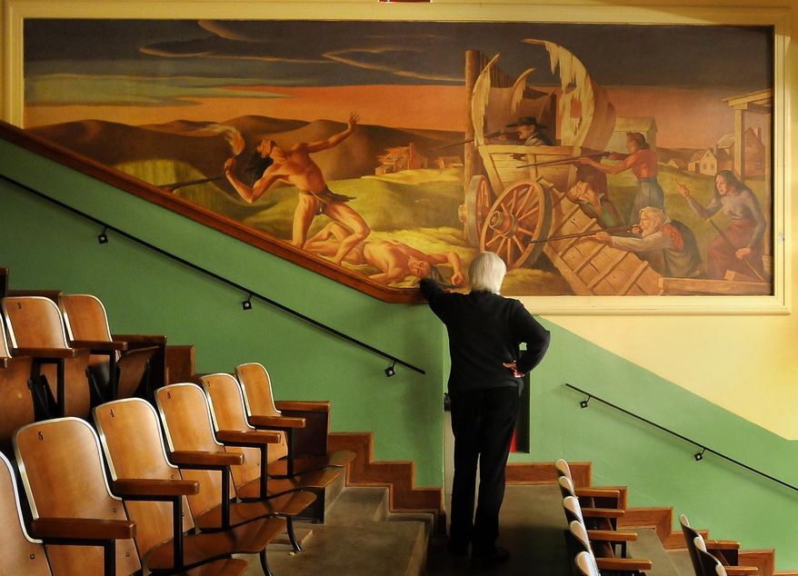 ADVANCED FOR RELEASE MONDAY, MARCH 31, 2014 New Ulm, Minn. resident George Glotzbach views one of three murals in the auditorium of the old New Ulm High School, March 25, 2013. The murals were commissioned via the New Deal-era Works Progress Administration and installed in 1939. (AP Photo/Mankato Free Press, John Cross)