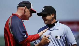 Washington Nationals manager Matt Williams, left, argues with umpire Jeff Gosney after Gosney ejected Bryce Harper in the fourth inning of an exhibition spring training baseball game against the St. Louis Cardinals, Wednesday, March 26, 2014, in Jupiter, Fla. (AP Photo/David Goldman)