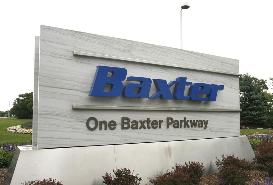 FILE - This July 2009 file photo shows the sign outside Baxter International Inc. in Deerfield, Ill. Baxter International Inc. on Thursday, March 27, 2014 announced it is splitting itself into two separate businesses _ one focusing on biopharmaceuticals and the other on other medical products. (AP Photo/Arlington Heights Daily Herald, George LeClaire, File) MANDATORY CREDIT; MAGS OUT