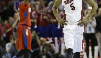 Stanford guard Chasson Randle (5) walks off the court after the second half in a regional semifinal game against Dayton at the NCAA college basketball tournament, Thursday, March 27, 2014, in Memphis, Tenn. Dayton won 82-72. (AP Photo/Mark Humphrey)