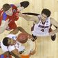 Stanford center Stefan Nastic (4) and Dayton forward/center Matt Kavanaugh (35) vie for a loose ball during the first half in a South regional semifinal game at the NCAA Tournament on Thursday in Memphis, Tenn. (Associated Press)