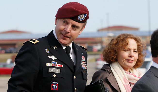 Brig. Gen. Jeffrey Sinclair, left, who admitted to inappropriate relationships with three subordinates, arrives at the courthouse with attorney Ellen Brotman, right, for sentencing at Fort Bragg, N.C., Thursday, March 20, 2014.  Sinclair was reprimanded and docked $20,000 in pay Thursday, avoiding jail time in one of the U.S. military&#x27;s most closely watched courts-martial. (AP Photo/Ellen Ozier)