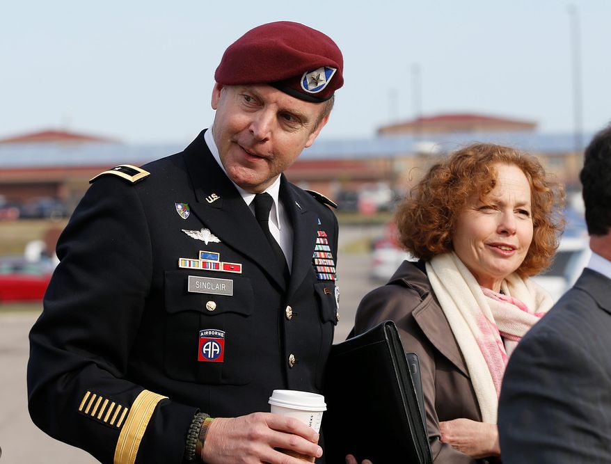 Brig. Gen. Jeffrey Sinclair, left, who admitted to inappropriate relationships with three subordinates, arrives at the courthouse with attorney Ellen Brotman, right, for sentencing at Fort Bragg, N.C., Thursday, March 20, 2014. Sinclair was reprimanded and docked $20,000 in pay Thursday, avoiding jail time in one of the U.S. military's most closely watched courts-martial. (AP Photo/Ellen Ozier)