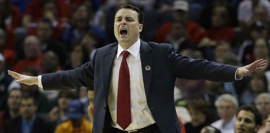 Dayton head coach Archie Miller speaks to players against Stanford during the first half in a regional semifinal game at the NCAA college basketball tournament, Thursday, March 27, 2014, in Memphis, Tenn. (AP Photo/Mark Humphrey)