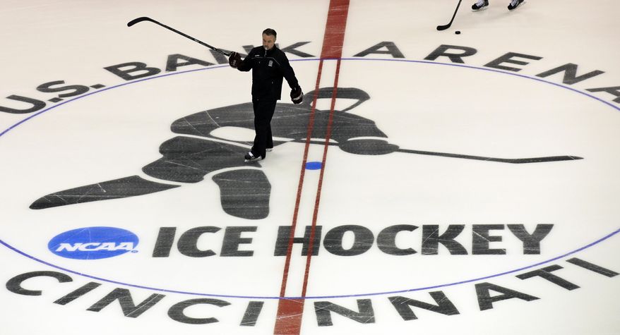 Colgate head coach Don Vaughan skates during practice, Thursday, March 27, 2014, in Cincinnati. Colgate plays Ferris State Friday night in an NCAA regional hockey game. (AP Photo/Al Behrman)