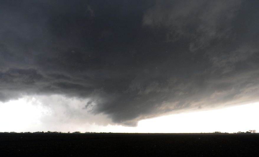 A funnel cloud near Road 24 and Road X recedes into the sky as severe storm brought funnel clouds and a report of a tornado touchdown Wednesday, March 26, 2014 near Ord Bend, Calif. (AP Photo/The Chico Enterprise-Record, Jason Halley)