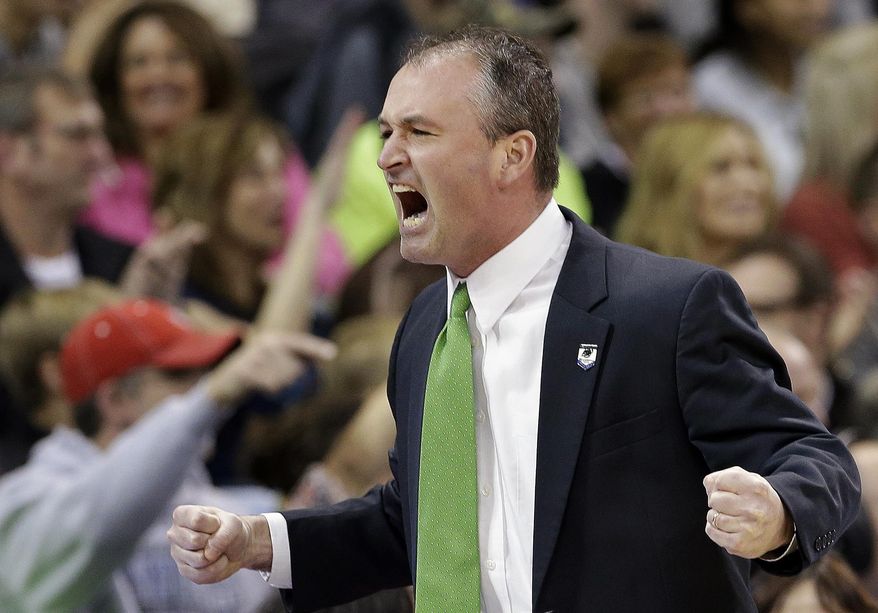 FILE - In this March 22, 2014 file photo, North Dakota State head coach Saul Phillips reacts to a basket during NDSU's 63-44 loss to San Diego State in a third round game of the NCAA men's college basketball tournament in Spokane, Wash. Phillips is among 15 finalists for the 2014 Hugh Durham Award. The winner will be announced at the CollegeInsider.com Awards Banquet on April 4 in Dallas, site of this year’s Final Four. (AP Photo/Elaine Thompson, File)