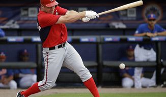 Washington Nationals&#39; Jordan Zimmermann singles to score teammate Wilson Ramos in the second inning of an exhibition spring training baseball game against the New York Mets, Thursday, March 27, 2014, in Port St. Lucie, Fla. (AP Photo/David Goldman)