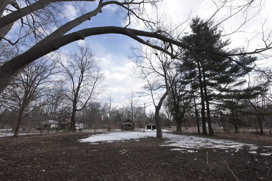 An empty lot where a home was demolished is shown in Detroit’s Brightmoor area Monday, March 24, 2014, in Detroit. For years, Brightmoor area residents pleaded with the city to demolish vacant homes that scavengers have stripped of wiring and plumbing and anything of value. Some structures are already gone, and now officials aim to do much more, possibly tearing down as many as 450 empty houses each week across more than 20 square miles of this bankrupt city _ a vast patchwork of rotting homes comparable to the size of Manhattan. (AP Photo/Paul Sancya)