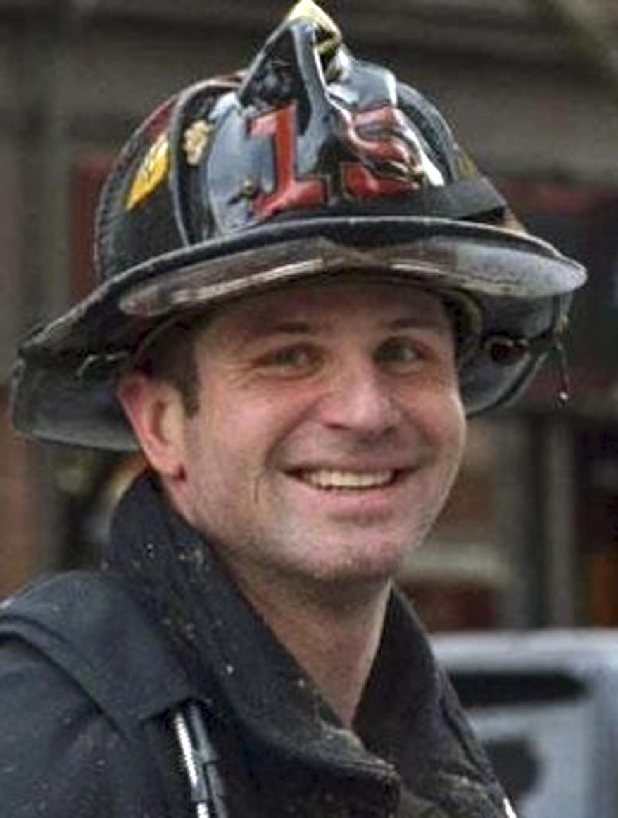 This undated photo released by the Boston Fire Department via Twitter shows firefighter Michael R. Kennedy, killed Wednesday, March 26, 2014, when trapped the basement while fighting a fire in an apartment building in Boston. Kennedy, 33, a Marine Corps combat veteran was assigned to Ladder 15, and had been a firefighter for more than six years. (AP Photo/Boston Fire Department)