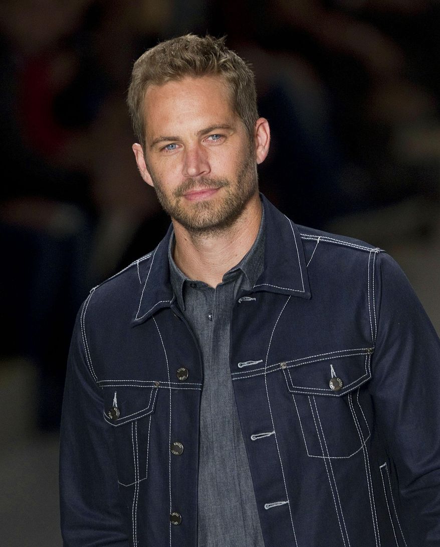 FILE - This March 21, 2013 file photo shows U.S. actor Paul Walker wearing a creation from the Colcci summer collection at Sao Paulo Fashion Week in Sao Paulo, Brazil. An attorney for Walker's mother delayed a hearing on a temporary guardianship for the late actor's 15-year-old daughter on Thursday March 27, 2014, to allow attorneys to try to work out an agreement for the teenager's care. (AP Photo/Andre Penner, File)