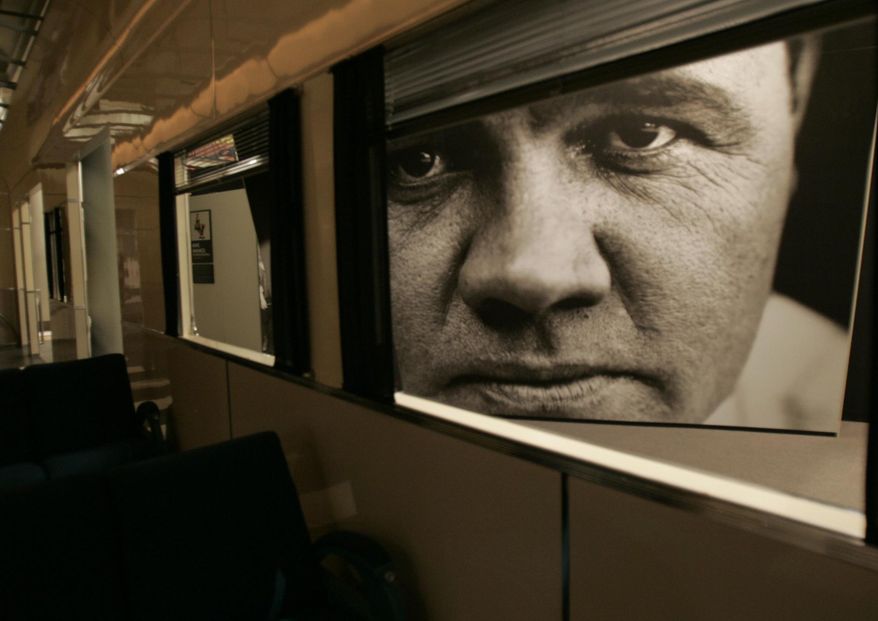 FILE - This May 13, 2005 file photo shows a large photograph of Babe Ruth used for an exhibit at the Sports Legends at Camden Yards museum in Baltimore. There are many destinations of interest to baseball fans around the country outside ballparks from museums and statues to historic homes. (AP Photo/Chris Gardner, File)