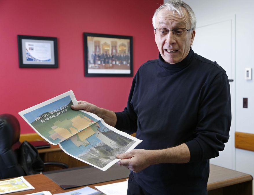 In this Feb. 24, 2014 photo, Bill Laubernds talks the reuse plan for the former Newport Chemical Depot near Newport, Ind. Laubernds, executive director of the Newport Chemical Depot Reuse Authority, has since 2009 been trying to build a new future at the Newport site, complete with businesses, industrial investment and natural, open space in the confines of the fenced-in expanse that used to house part of the country’s chemical weapons stockpile. The last truck filled with VX left the depot in 2008. (AP Photo/Journal & Courier, John Terhune)