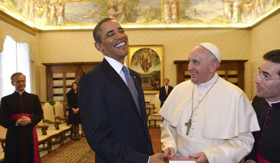 ** FILE ** Pope Francis and President Barack Obama smile as they exchange gifts, at the Vatican Thursday, March 27, 2014. (AP Photo/Gabriel Bouys, Pool)