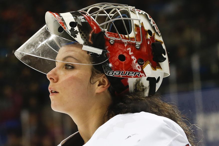 FILe - In this Feb. 17, 2014 file photo, goalkeeper Shannon Szabados of Canada skates off the ice after the second period of the 2014 Winter Olympics women's semifinal ice hockey game against Switzerland at Shayba Arena in Sochi, Russia. After winning gold with the Canadian Olympic women's hockey team, Szabados signed on with a men's minor league team in Georgia. What she and other gifted athletes really need is more leagues of their own. (AP Photo/Petr David Josek, File)