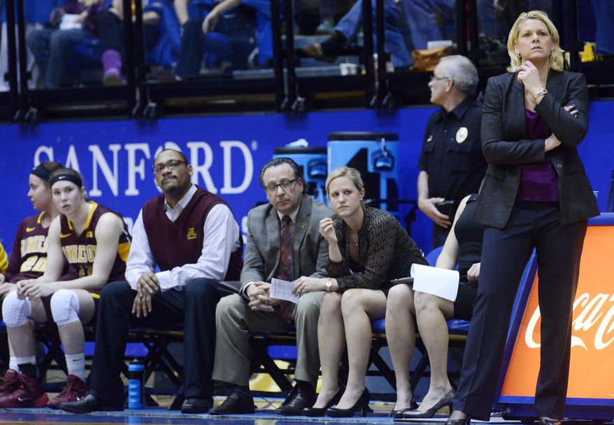 Minnesota head coach, Pam Borton watches her team in the final minutes of their 70-62 loss to South Dakota State in the third round WNIT basketball game at Frost Arena in Brookings, S.D., Thursday, March 27, 2014. (AP Photo/Argus Leader, Elisha Page) NO SALES