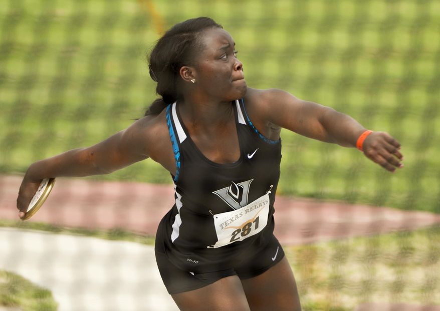 Patricia Nintcheu of Austin Vandegrift competes in the high school girls discus throw at the Texas Relays at Mike A. Myers Stadium in Austin, Texas, on Friday March 28, 2014. (AP Photo/Austin American-Statesman, Jay Janner)