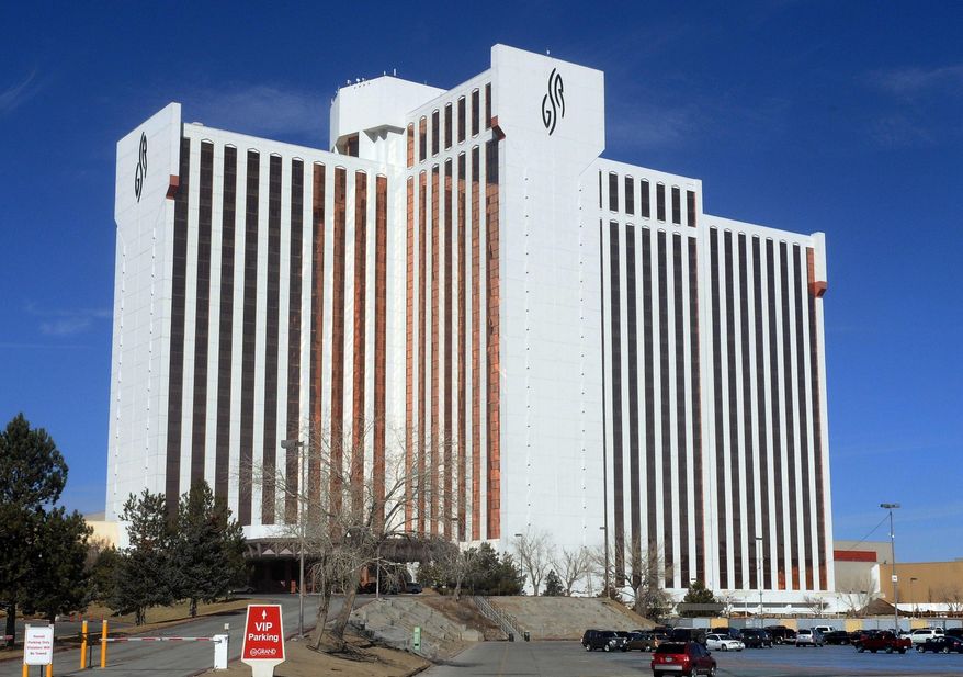 This Feb. 21, 2014 photo shows the the Grand Sierra Resort & Casino along the banks of the Truckee River in Reno, Nev. Casino operators in the greater Reno/Tahoe area are doubling down on their properties. The more than $100 million spent or tabbed for renovations at regional hotel-casinos includes $50 million at JA Nugget, $20 million at Boomtown, $30 million at Grand Sierra Resort, $20 million at the Hyatt Regency Lake Tahoe in Incline Village and more than $40 million at the Horizon at South Lake Tahoe. (AP Photo/Reno Gazette-Journal, Marilyn Newton)