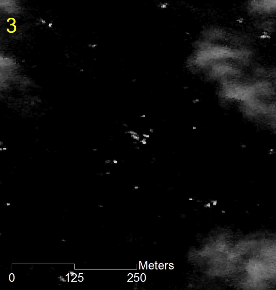 In this imagery taken by the Thaichote satellite on March 24, 2014 and released March 27, 2014 by Geo-Informatics and Space Technology Development Agency (GISTDA), a part of about 300 objects floating in the Indian Ocean near the search area for the missing Malaysia Airlines jetliner are shown. Anond Snidvongs, director of Thailand's space technology development agency, said the images showed "300 objects of various sizes" in the southern Indian Ocean about 2,700 kilometers (1,675 miles) southwest of Perth, Australia. (AP Photo/Geo-Informatics and Space Technology Development Agency)