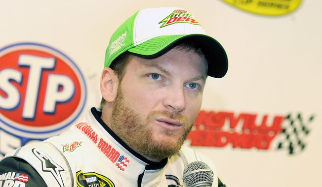 NASCAR Sprint Cup driver Dale Earnhardt Jr. speaks to the media during a press conference prior to practice at Martinsville Speedway in Martinsville, Va., Friday March 28, 2014. (AP Photo/Mike McCarn)