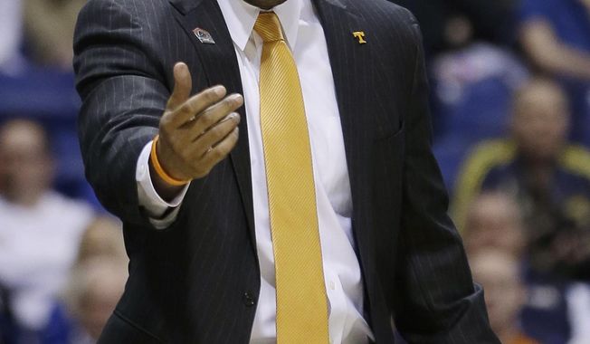 Tennessee head coach Cuonzo Martin yells during the first half of an NCAA Midwest Regional semifinal college basketball tournament game against the Michigan Friday, March 28, 2014, in Indianapolis. (AP Photo/David J. Phillip)