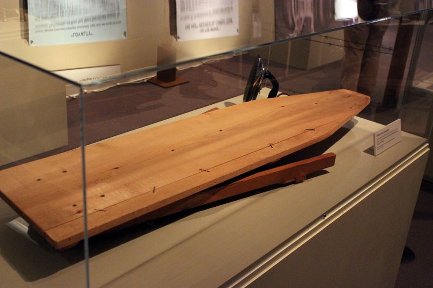 This March 26, 2014 photo shows, a folding ironing board that was hand-crafted and polished by Himeko Fukuhara in New Orleans. Nearly 120,000 Japanese-American men, women and children were sent without trial to 10 internment camps soon after the United States entered World War II. The board was lent by the Smithsonian Institution, National Museum of American History, Kenneth E. Behring Center for an exhibit at the National World War II titled “From Barbed Wire to Battlefields,” about life in the internment camps and the Japanese-American soldiers who fought for the United States. (AP Photo/Janet McConnaughey)