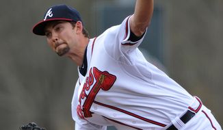 Atlanta Braves starting pitcher Mike Minor delivers during the first inning of an exhibition baseball game against the team&#39;s minor league Future Stars Saturday, March 29, 2014, in Rome, Ga. (AP Photo/David Tulis)