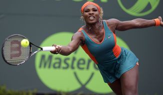 Serena Williams returns to Li Na, of China, during the women&#39;s final at the Sony Open Tennis tournament, Saturday, March 29, 2014, in Key Biscayne, Fla. (AP Photo/Lynne Sladky)