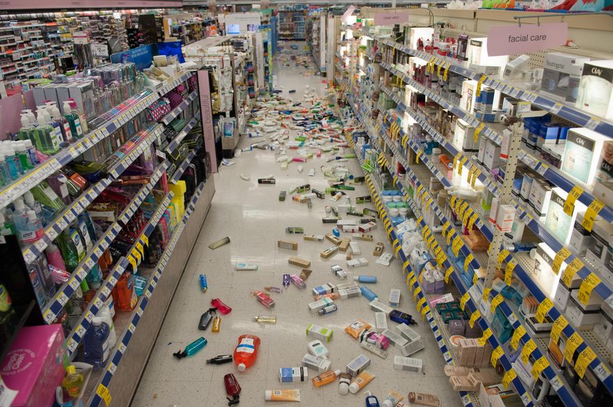 Merchandise is strewn across the floor in a La Habra Walgreens following a 5.1 earthquake centered near La Habra Friday night March 28, 2014. (AP Photo/The Orange County Register, Blaine, Ohigashi)