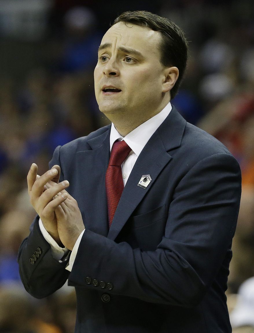 Dayton head coach Archie Miller speaks to players against Florida during the first half in a regional final game at the NCAA college basketball tournament, Saturday, March 29, 2014, in Memphis, Tenn. (AP Photo/Mark Humphrey)