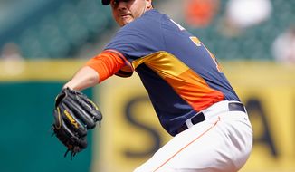 Houston Astros&#39; Mark Appel throws in the first inning of a spring exhibition baseball game against Rojos del Aguila de Veracruz on Sunday, March 30, 2014, in Houston. (AP Photo/Bob Levey)