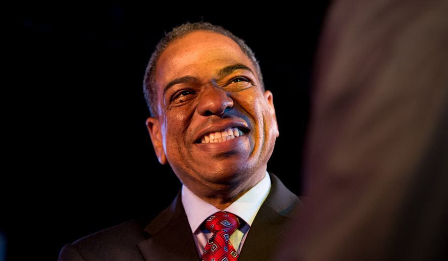 Mayoral Candidate and Councilmember Vincent Orange (D-At Large) smiles before beginning a mayoral debate hosted by the Washington City Paper at the Black Cat on 14th St. in Northwest, Washington, D.C., Sunday, March 16, 2014. (Andrew Harnik/The Washington Times)