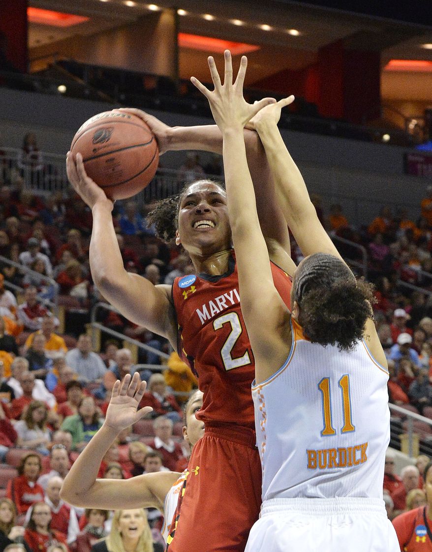 Maryland's Alyssa Thomas, left, shoots over the defense of Tennessee's Cierra Burdick during the second half in a regional semifinal game at the NCAA women's college basketball tournament on Sunday, March 30, 2014, in Louisville, Ky. Maryland defeated Tennessee 73-62. (AP Photo/Timothy D. Easley)