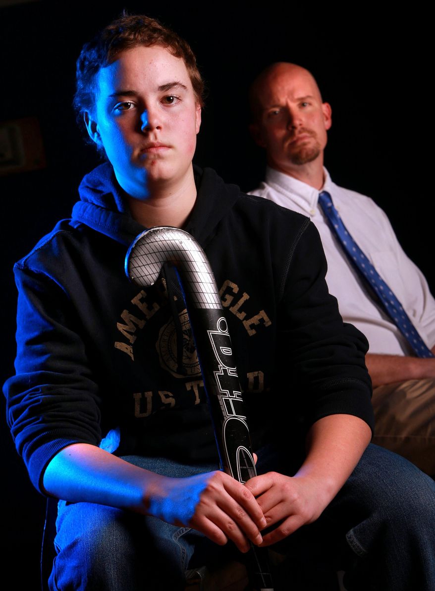 Eureka High School sophomore Matthew Bozdech and his father, Paul Bozdech, are photographed on March 21, 2014 in St. Louis. Bozdech, 15, wants to play field hockey for his school, but the school only has a girls team. No school in Missouri, or for hundreds of miles around, has a boys team. The Bozdechs filed a civil rights complaint with the U.S. Department of Education alleging Matt was discriminated against because he’s a boy, and was retaliated against for complaining about his exclusion. (AP Photo/St. Louis Post-Dispatch, Christian Gooden) EDWARDSVILLE INTELLIGENCER OUT; THE ALTON TELEGRAPH OUT