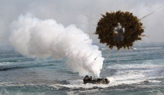 A South Korean marine LVT-7 landing craft sail to shores through a smoke screen during the U.S.-South Korea joint landing exercises called Ssangyong, part of the Foal Eagle military exercises, in Pohang, South Korea, Monday, March 31, 2014.  South Korea said North Korea has announced plans to conduct live-fire drills near the rivals&#39; disputed western sea boundary. The planned drills Monday come after an increase in threatening rhetoric from Pyongyang and a series of rocket and ballistic missile launches in an apparent protest against the annual military exercises by Seoul and Washington.  (AP Photo/Ahn Young-joon)