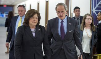 United States Secret Service director Julia Pierson and Senate Homeland Security Committee Chairman Tom Carper, D-Del., leave a committee hearing on recent Secret Service agents behavior, on Capitol Hill in Washington, Tuesday, April 1, 2014. (AP Photo/Cliff Owen) ** FILE ** 