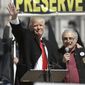 Donald Trump, left, and Carl Paladino, who ran for governor of New York as a Republican in 2010, speak during a gun rights rally at the Empire State Plaza on Tuesday, April 1, 2014, in Albany, N.Y. (AP Photo/Mike Groll) 