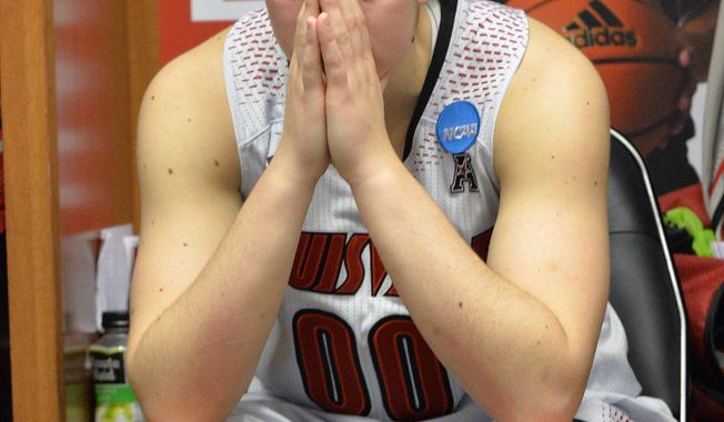 Louisville&#x27;s Sara Hammond pauses in the locker room following a regional final against Maryland in the NCAA women&#x27;s college basketball tournament Tuesday, April 1, 2014, in Louisville, Ky. Maryland defeated Louisville 76-73. (AP Photo/Timothy D. Easley)