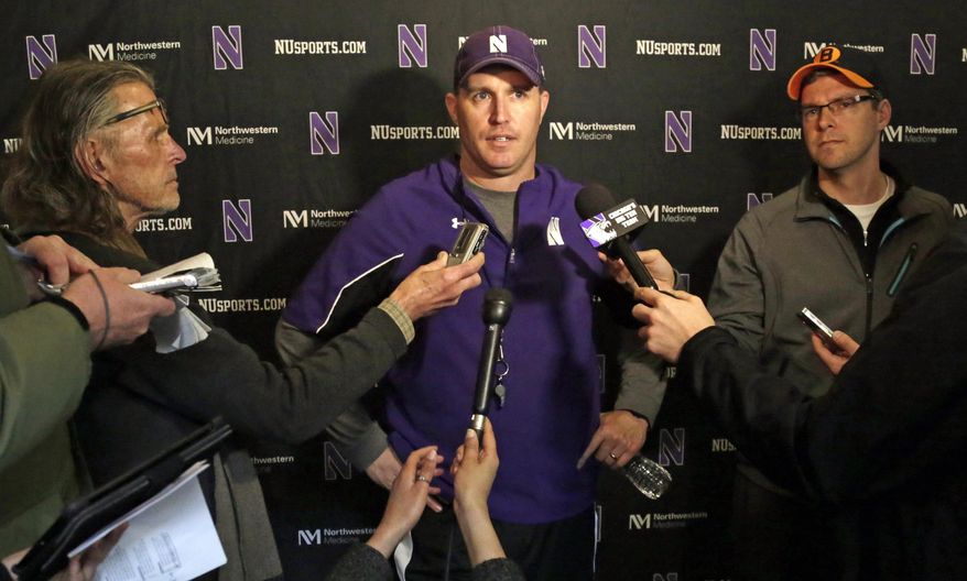 Northwestern head football coach Pat Fitzgerald speaks at a news conference after his football team participated in an NCAA college spring football practice Tuesday, April 1, 2014, in Evanston, Ill. After spring break, Northwestern resumed spring football practices with a huge issue that could change the college sports landscape hanging over their heads. A regional director of the National Labor Relations Board ruled last week that the team can bargain with the school as employees. (AP Photo/M. Spencer Green)