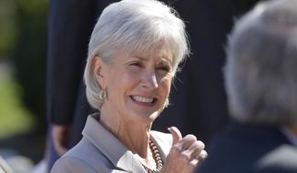 **FILE** Health and Human Services Secretary Kathleen Sebelius sits in the audience as she waits for President Barack Obama to make a statement on the Affordable Care Act on April 1, 2014, in the Rose Garden of the White House. (Associated Press)