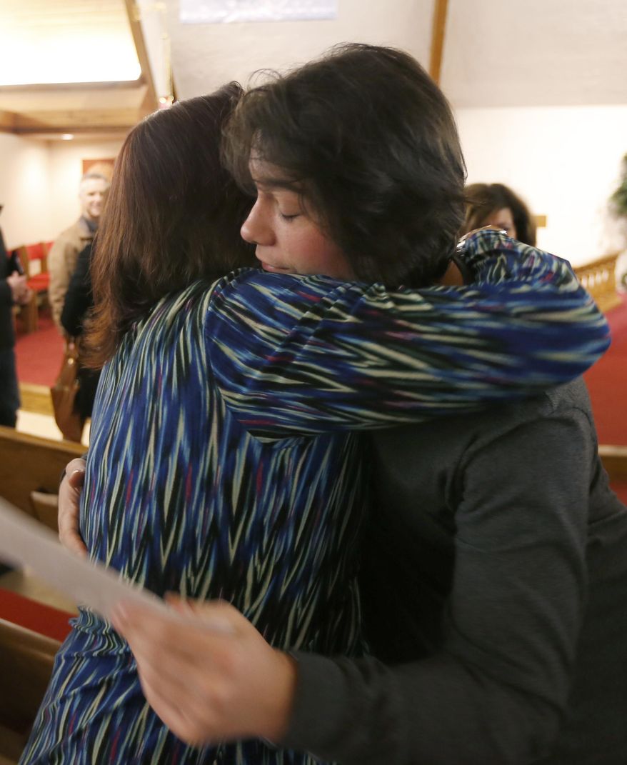 ADVANCE FOR USE TUESDAY, APRIL 8, 2014 AND THEREAFTER - In this Thursday, Feb. 20, 2014 photo, Karen Lewis hugs her son, Cody, a recovering heroin addict, after he spoke about his life and addiction at the Good Samaritan Methodist Church in Addison, Ill. &amp;quot;I will be there for him as long as I can,&amp;quot; she says. &amp;quot;Cody&#39;s finally ... coming back to the person that he used to be.&amp;quot; (AP Photo/Charles Rex Arbogast)