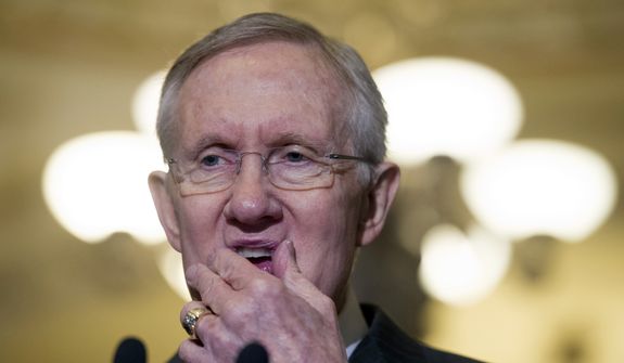 Senate Majority Leader Harry Reid of Nev. pauses while speaking with reporters on Capitol Hill in Washington, Tuesday, April 1, 2014, following a Senate Policy Luncheon. (AP Photo/Cliff Owen)